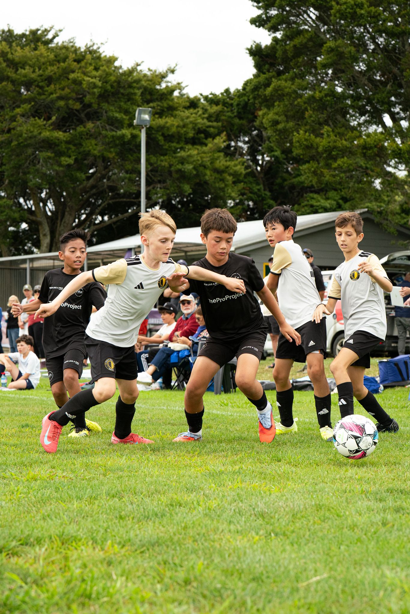 Players battling for the ball in an intense competitive match